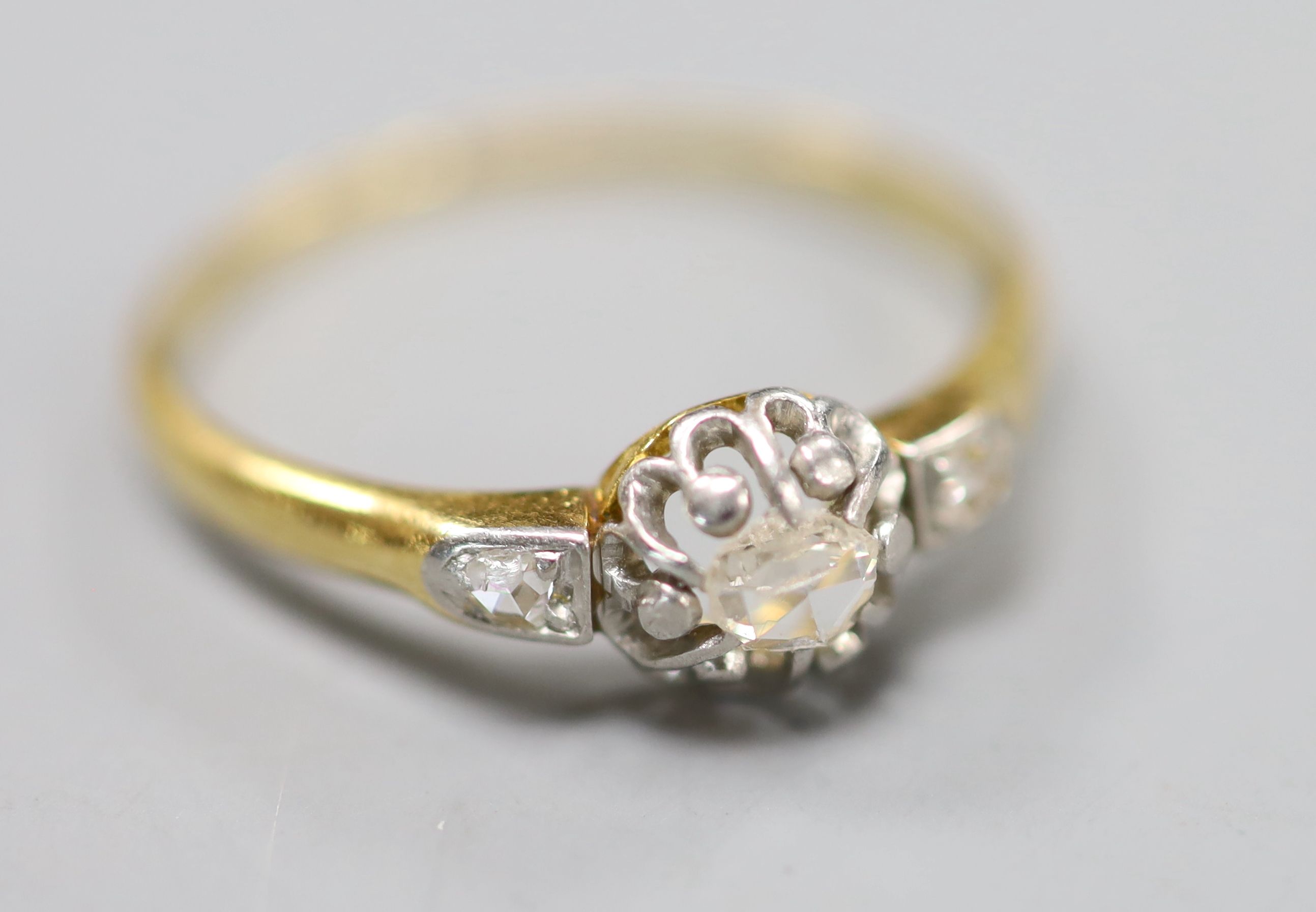 A yellow metal and single stone rose cut diamond set ring, with diamond set shoulders, size Q/R, gross 2.4 grams.